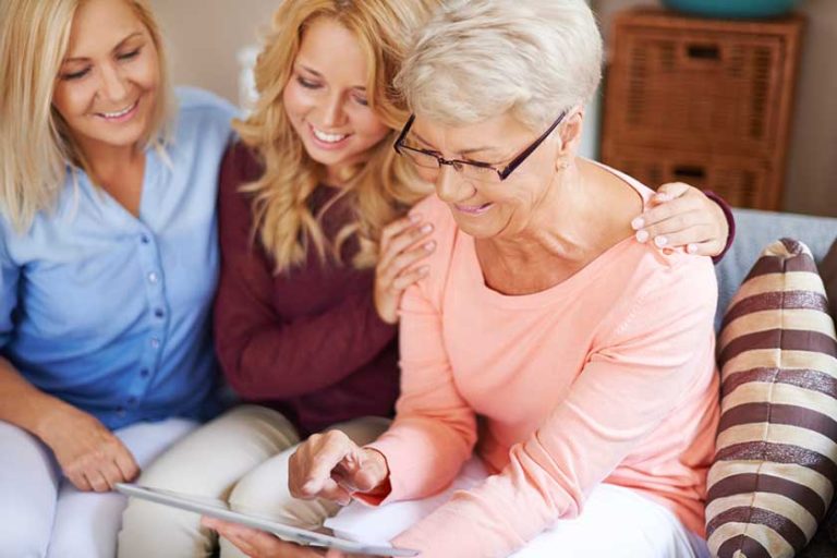 Girl with mom supporting grandma Girl with mom supporting grandma