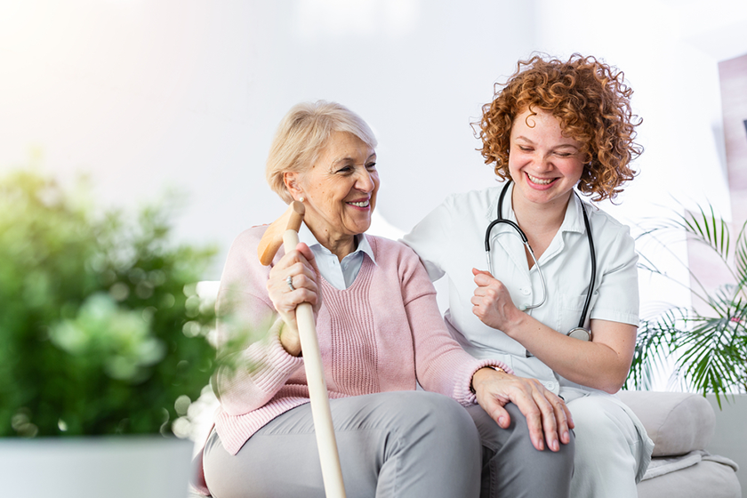 Happy senior woman and young healthcare worker