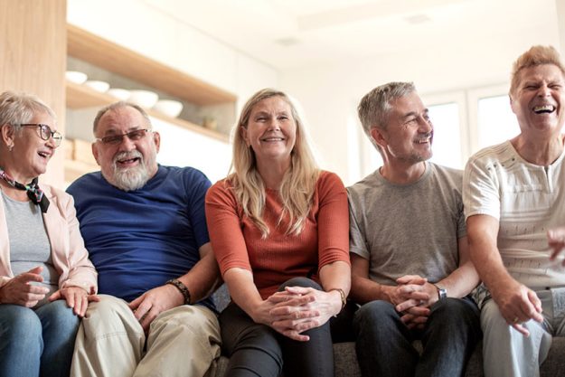 Mature friends sitting on the couch Mature friends sitting on the couch