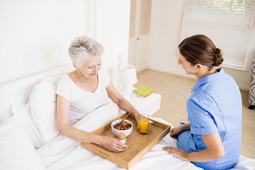 Nurse taking care of suffering senior patient Nurse taking care of suffering senior patient