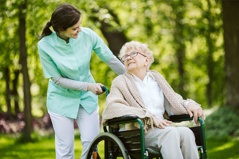 Nurse touching shoulder of senior