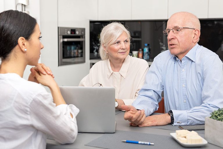 Senior couple planning their investments Senior couple planning their investments