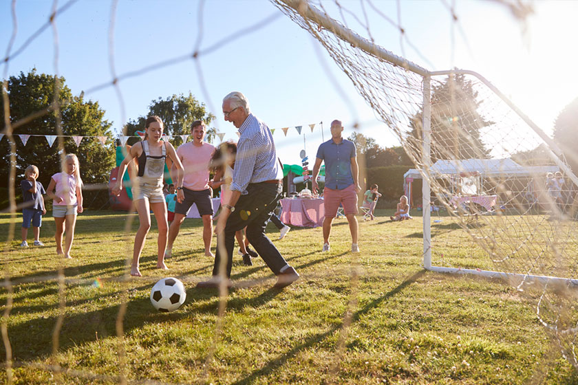 Group of seniors playing with a football