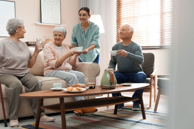 Young woman taking care of elderly people Young woman taking care of elderly people