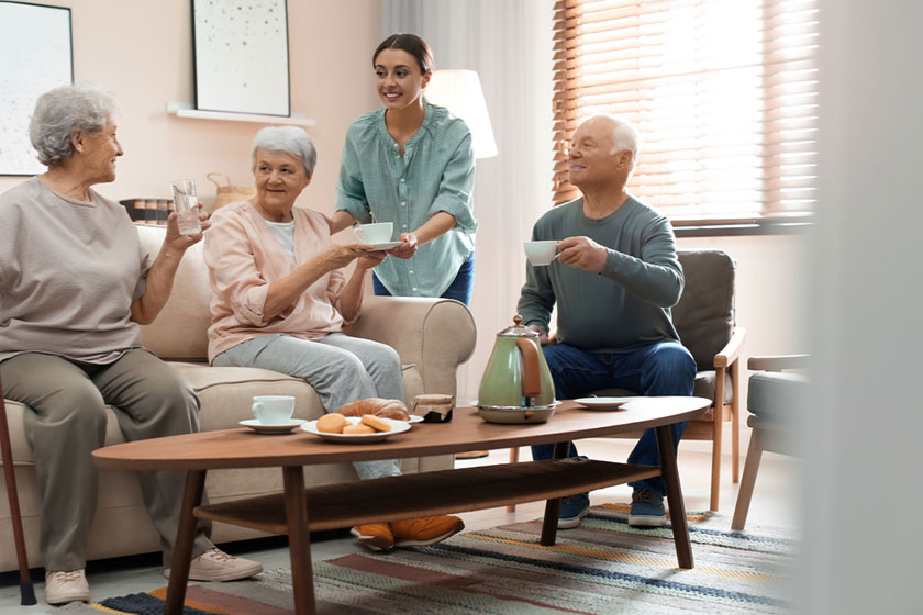 Young woman taking care of elderly people Young woman taking care of elderly people