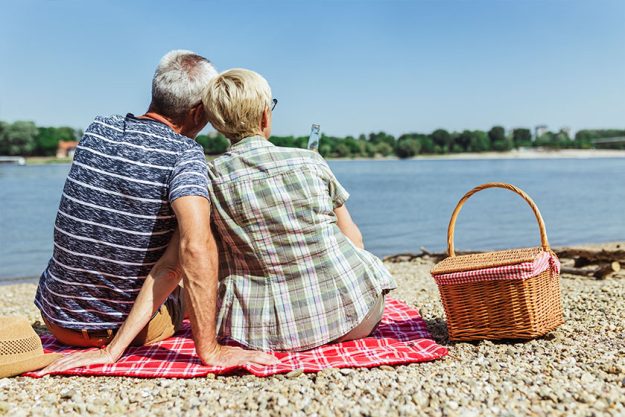 Cute Senior Couple Enjoying Picnic Time Riverside Cute Senior Couple Enjoying Picnic Time Riverside