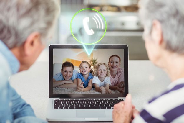Senior couple having video call with family