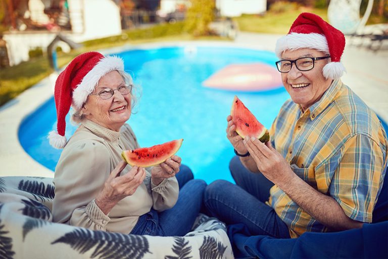 Senior couple with Santa hats at Christmas time Senior couple with Santa hats at Christmas time