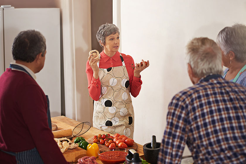 Shot of a woman instructing a cooking class