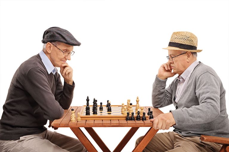 Two senior gentlemen playing chess Two senior gentlemen playing chess