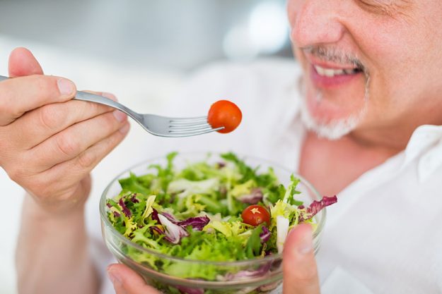 Man eating salad