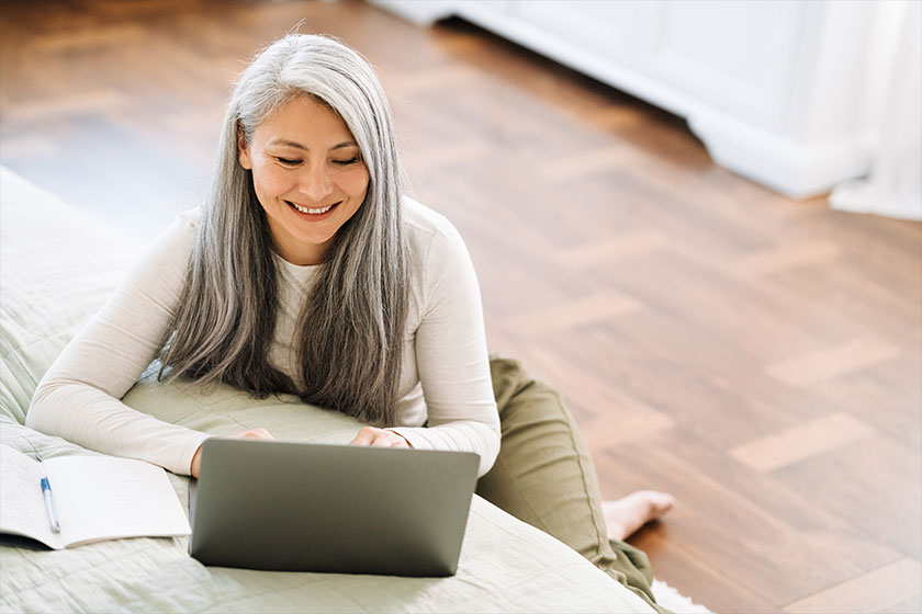 Mature Asian Woman Grey Hair Working Laptop