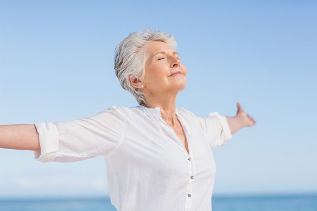 Senior woman relaxing on the beach