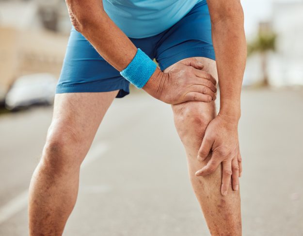 Fitness, knee pain and hands of senior man with muscle ache, painful joint and injury after running in city. Sports, body wellness and male athlete rest after workout, marathon training and exercise Don't Let Knee Pain Stop You From Enjoying An Active Retirement Lifestyle