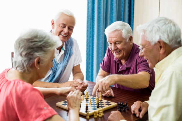 Seniors playing chess Enriching Senior's Life With Community Life In Memory Care Nursing Homes In Dallas, TX