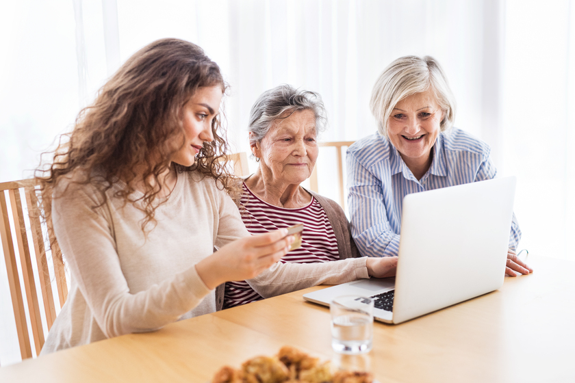 A teenage girl, mother and grandmother with laptop at home. How Can You Pay For A Senior Apartment Before Selling Your House?