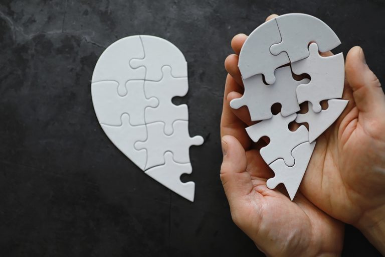 White heart-shaped puzzle. Heart affairs. Undivided love. Broken Mild Cognitive Impairment (MCI) Treatment In Dementia Care Near North Richland Hills, TX