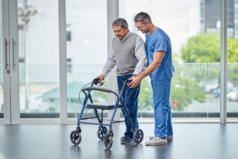 Improving mobility impairment one step at a time. Shot of a nurse helping a senior man with a walker. nurse helping a senior man