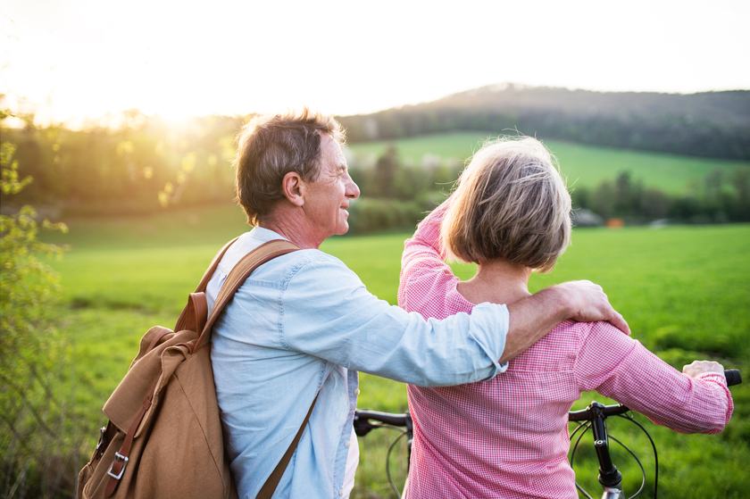 Beautiful senior couple with bicycles outside in spring nature. Sunset Spots To Explore Near Your Senior Home In Allen, TX