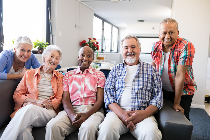 Portrait of multi-ethnic senior people sitting on couch The Advantages Of Joining An Assisted Living Facility Waitlist In Oslo, FL