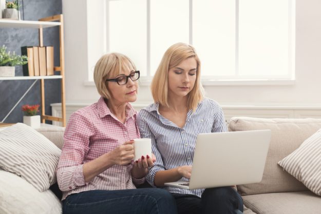Adult mother and daughter using laptop at home. The Reasons Why Your Aging Parents Should Be Involved In Choosing An Assisted Living Home In Quantico, VA