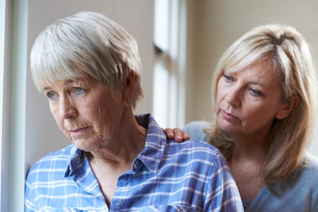 Serious Senior Woman With Adult Daughter At Home Understanding How Your Parents May Hide Signs Of Dementia