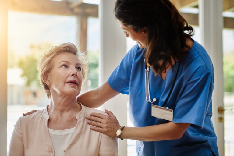 Well do everything we can to keep you healthy. a senior woman talking with a nurse in assisted living facility. Well do everything we can to keep you healthy. a senior woman talking with a nurse in assisted living facility.