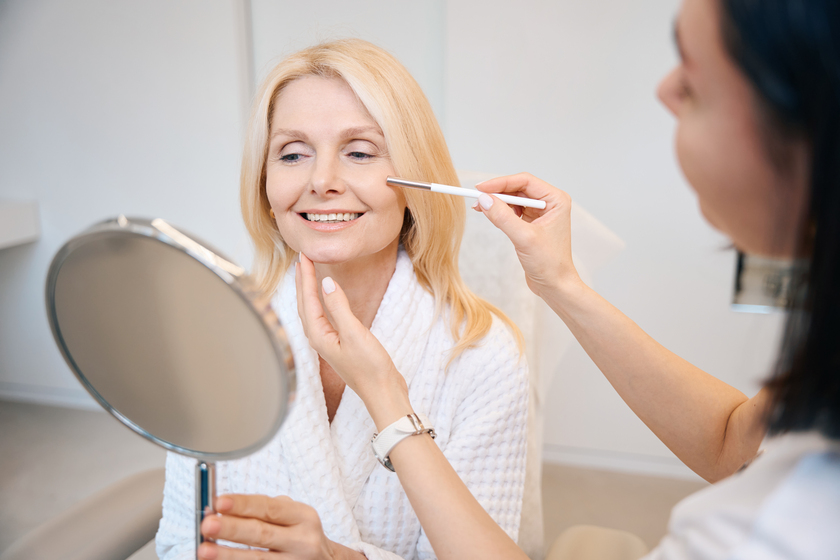 Pretty woman undergoes ultrasonic facial cleansing procedure