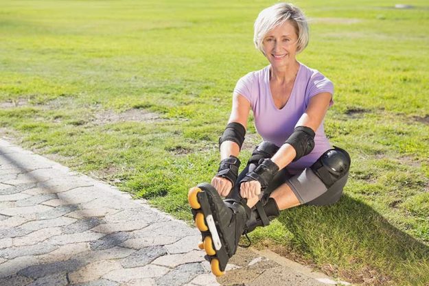 Active senior woman ready to go rollerblading