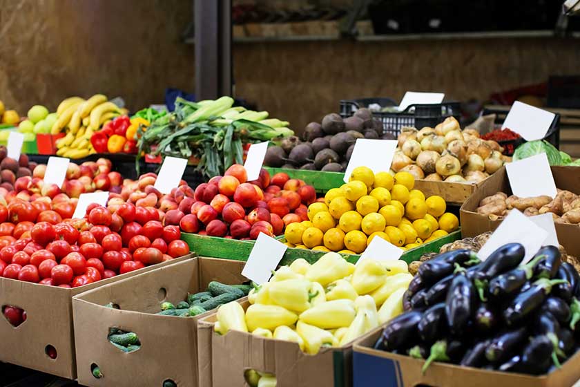 Assortment of fresh vegetables and fruits at market Assortment of fresh vegetables and fruits at market