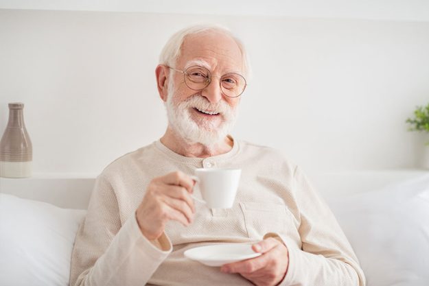 Photo of aged cheerful man pensioner happy