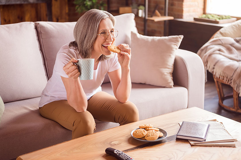 Portrait of attractive cheerful grey-haired woman sitting Portrait of attractive cheerful grey-haired woman sitting