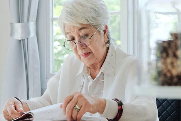 Senior woman reading a book Senior woman reading a book