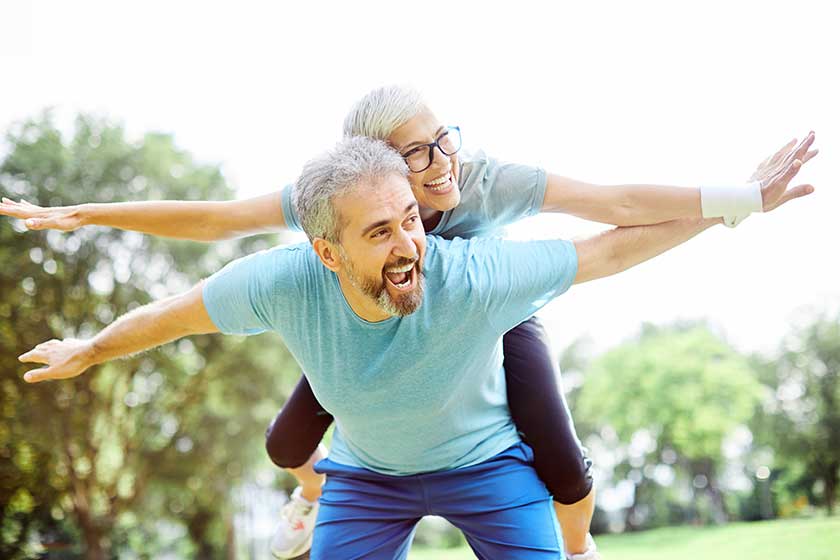 Smiling active senior couple having fun together