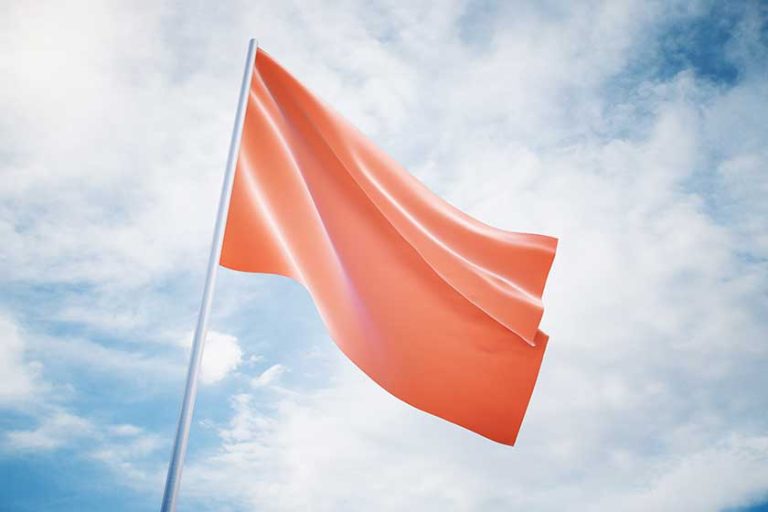 Waving red flag on a sky background Waving red flag on a sky background