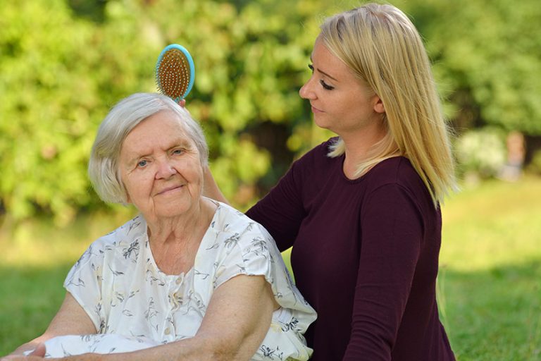 Grandmother and granddaughter posing