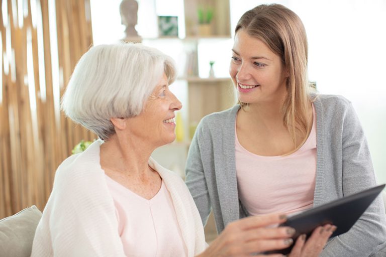Grandmother and granddaughter looking at tablet computer Grandmother and granddaughter looking at tablet computer
