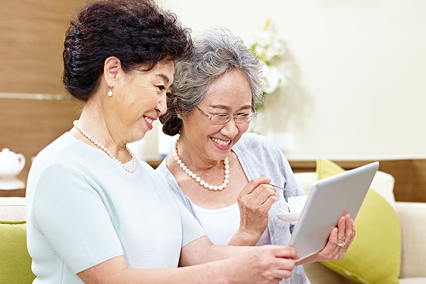 Senior asian women using tablet computer Senior asian women using tablet computer
