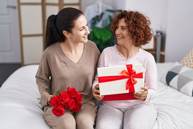 Two women mother and daughter surprise Two women mother and daughter surprise