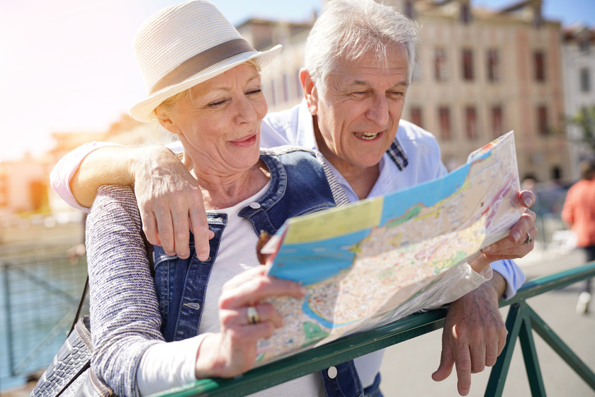 Senior couple of tourists looking at city map 4-ways-to-spend-your-weekends-in-downtown-norfolk-va