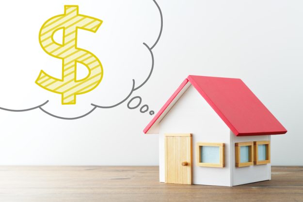 House and money. Miniature house and illustrations dollar sign i