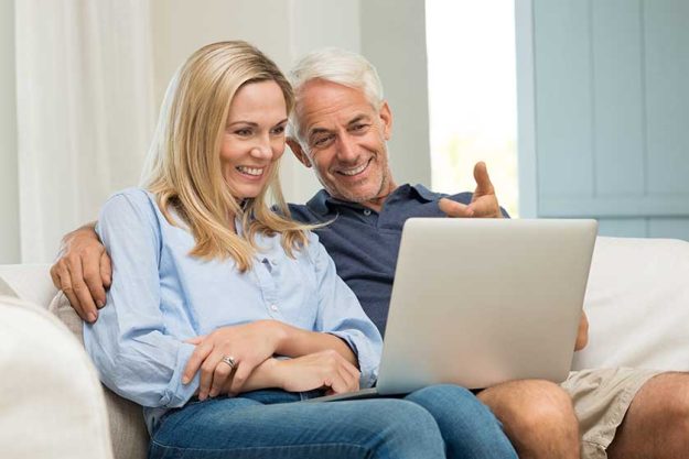 Couple working on laptop Couple working on laptop