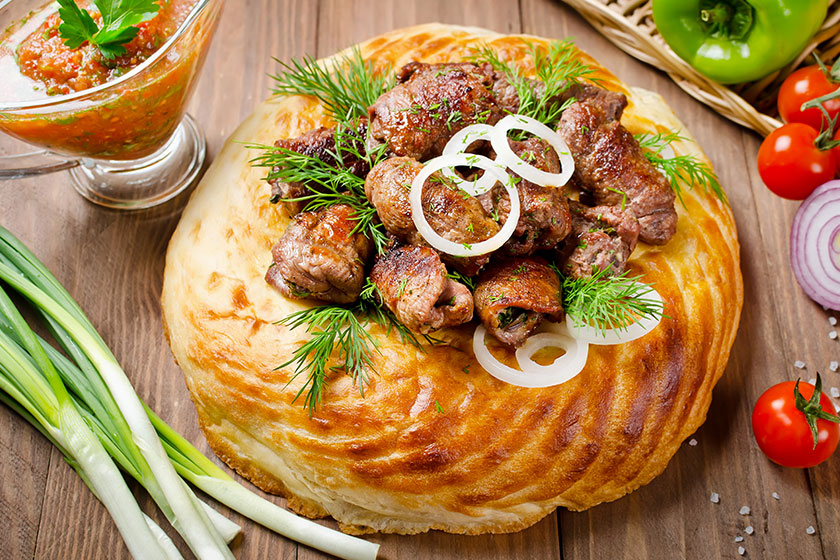 Lamb rolls with cilantro and purple onion in a tortilla