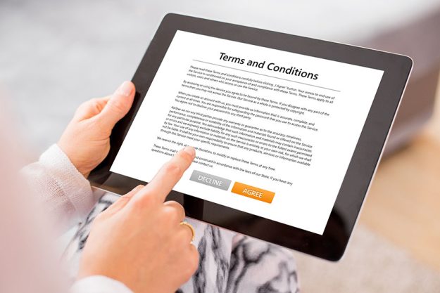 Person accepting terms and conditions on tablet