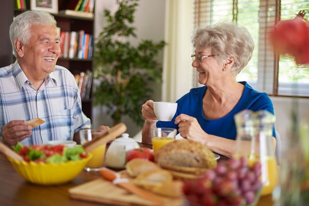Senior couple have breakfast together