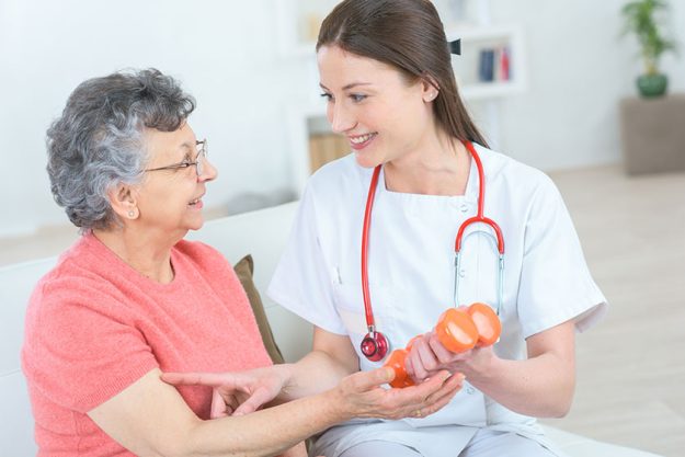 Senior woman lifting weights