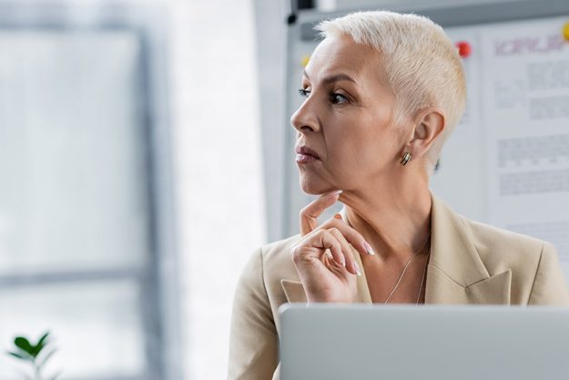 Stylish senior banker looking away Stylish senior banker looking away