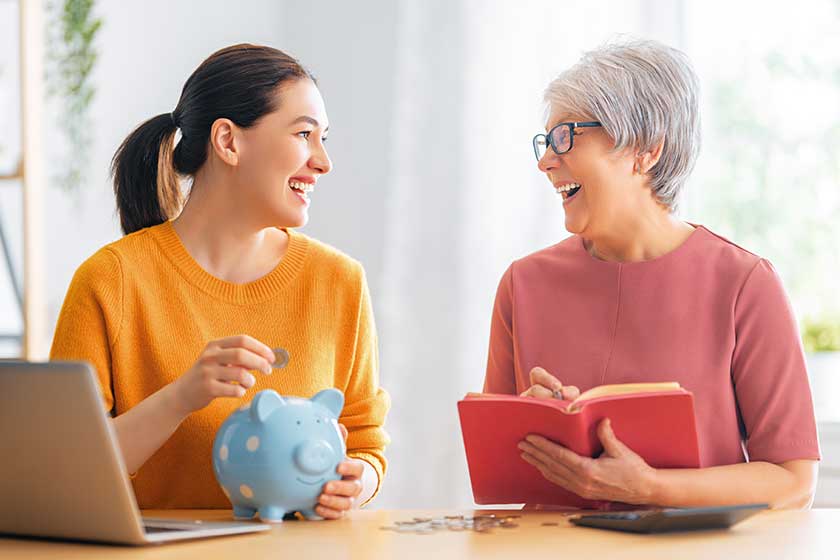 Two women are calculating expenses