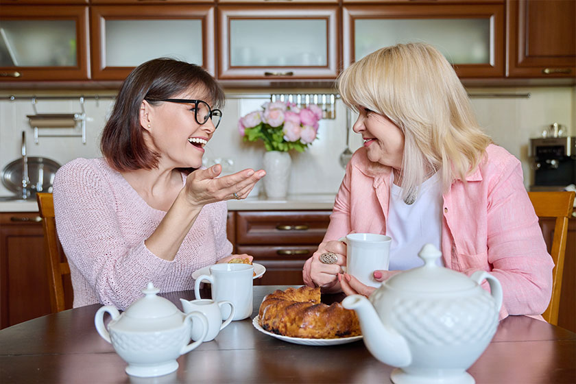 Friends two mature women drinking tea Friends two mature women drinking tea