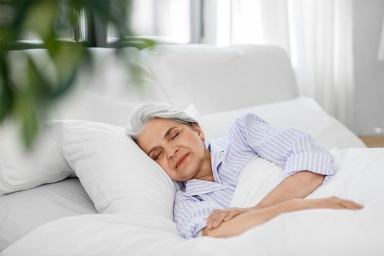 Senior woman sleeping in bed Senior woman sleeping in bed